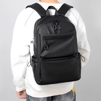 Uma mochila masculina de 14 polegadas de grande capacidade Viagem de lazer sólido colorido pu de mochila mochila de moda Moda e mulher bolsa escolar de estudantes