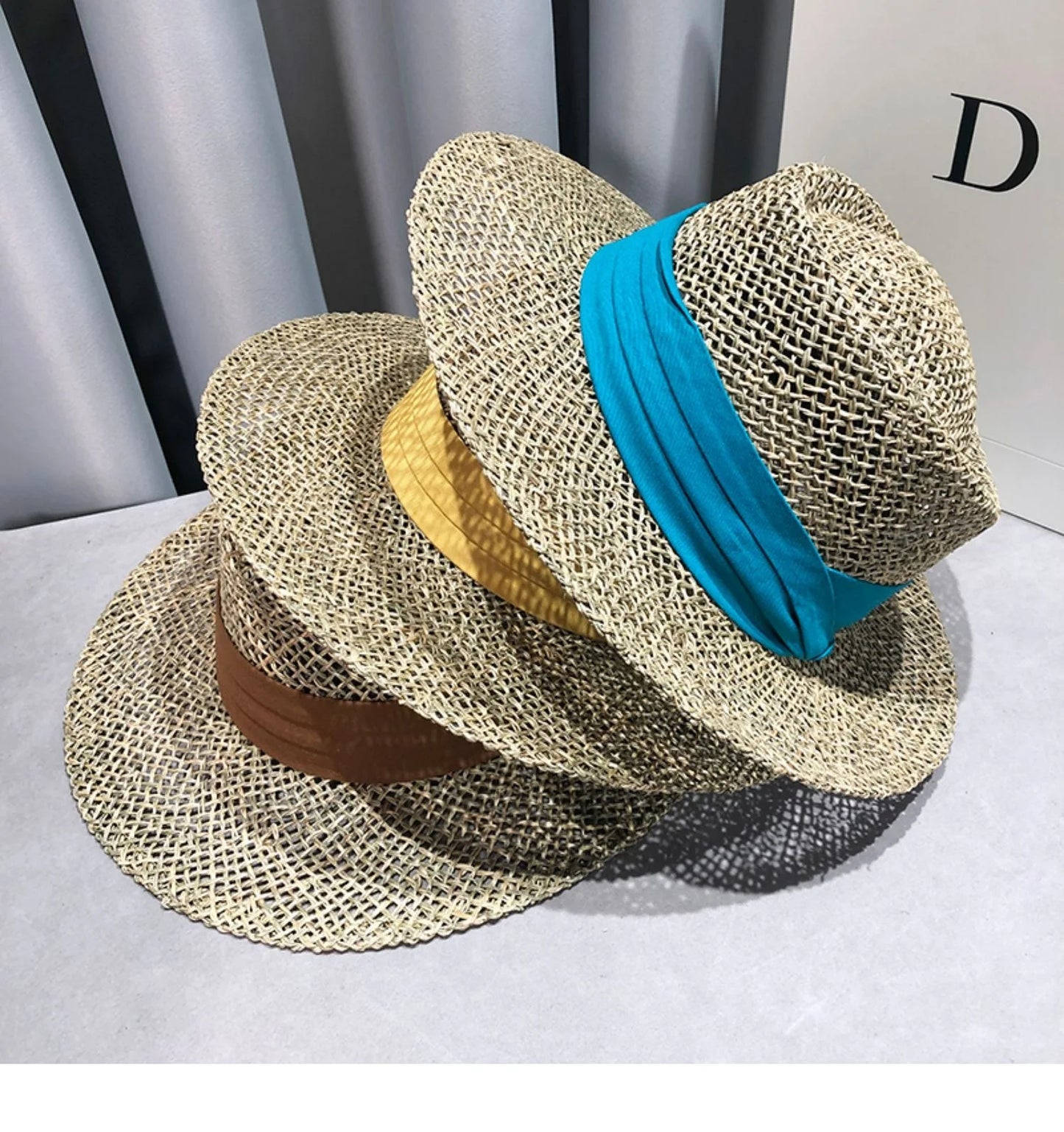 Gratë e Modës Verore Sunshade Sunshade Kapele të gjera Fradora për Udhëtimi Beach Beach Casual Hollow Out Simple Fedora Straw Hats